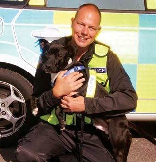 PC Lee Webb with cross-breed dog Tyson.