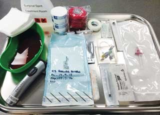 Figure 3. Equipment needed for intraosseous catheter placement, including hypodermic needles, bone marrow biopsy needle and local anaesthetic.
