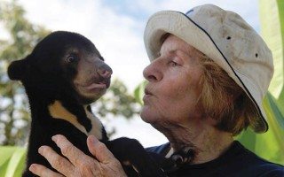 Mary Hutton with a rescued sun bear cub. Image: © Free the Bears.
