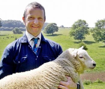 Julian Earl, carrying a 40kg lamb at home.