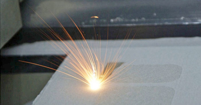 Figure 2. The selective laser sintering process: a CO2 laser hits a layer of powder material, binding particles together.