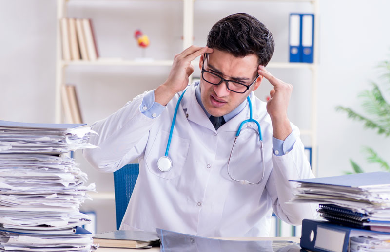 Stressed vet with paperwork. 