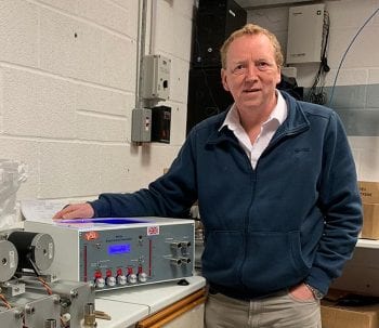 Keith Simpson with one of his company's Merlin machines.