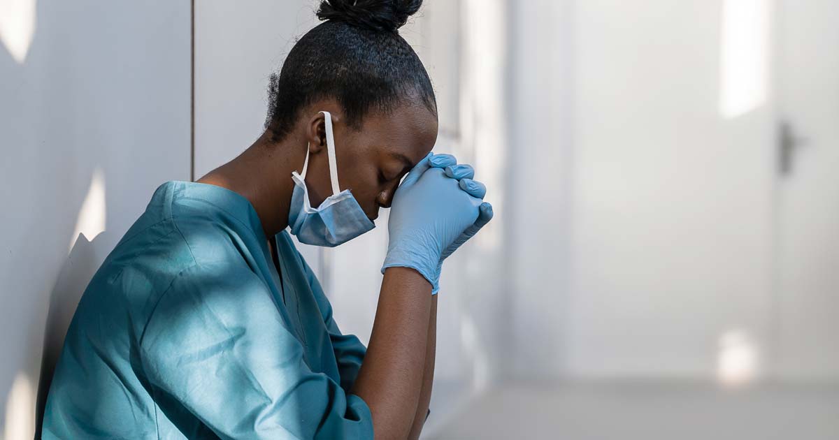 Medical woman kneeling.