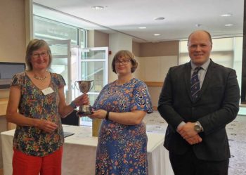 Presentation of Nick Clayton cup to Kate Hovers (centre) by Heather Arnold and Huw Clayton.